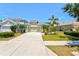 Charming one-story home with well-maintained landscaping, a concrete driveway, and an attached two-car garage at 12478 Sagewood Dr, Venice, FL 34293