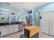Bright, open kitchen with granite countertops, a stainless steel dishwasher, and plenty of storage space at 12478 Sagewood Dr, Venice, FL 34293