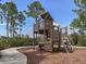 Community playground with wooden play structure and mature trees at 12478 Sagewood Dr, Venice, FL 34293