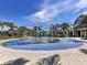 Community splash pad with palm tree features for endless summer fun at 12478 Sagewood Dr, Venice, FL 34293