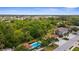 Beautiful aerial view of the community, highlighting the pool and lush landscaping of the Pinebrook Preserve at 129 Preserve Pl # D, Nokomis, FL 34275