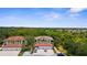 An aerial view of the property with attached garage and a parking area for guests at 129 Preserve Pl # D, Nokomis, FL 34275