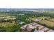 An aerial view featuring mature trees surrounding the property and its tranquil setting at 129 Preserve Pl # D, Nokomis, FL 34275