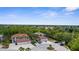 A stunning aerial view highlights the property's ample parking and lush landscaping at 129 Preserve Pl # D, Nokomis, FL 34275