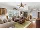 Comfortable living room filled with natural light, featuring shutters and stylish furnishings at 129 Preserve Pl # D, Nokomis, FL 34275