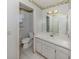 Bathroom with a vanity sink, and decorative butterfly wallpaper at 1320 Whispering Ln, Venice, FL 34285