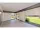 Screened-in lanai with tiled flooring and views of the backyard at 1320 Whispering Ln, Venice, FL 34285