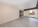 Spacious covered lanai with tiled flooring and sliding doors at 1320 Whispering Ln, Venice, FL 34285