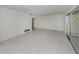 Spacious living room featuring tiled floors and sliding glass doors at 1320 Whispering Ln, Venice, FL 34285
