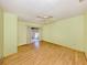 Living room featuring parquet floors, a sliding glass door, and a ceiling fan at 1320 Whispering Ln, Venice, FL 34285