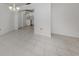 Living room featuring tiled floors with kitchen view at 1320 Whispering Ln, Venice, FL 34285
