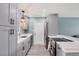 Beautiful kitchen featuring sleek gray cabinets, modern appliances, and ample countertop space, perfect for cooking at 13579 Romford Ave, Port Charlotte, FL 33981
