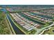 Stunning aerial view of the community showcasing homes along winding canals, offering picturesque waterfront living at 13731 Vadini St, Venice, FL 34293