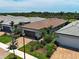 A nice residential area with attractive homes, palm trees, well-maintained lawns, and tidy landscaping at 13731 Vadini St, Venice, FL 34293