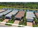 Aerial view showcasing the beautiful homes situated along the tranquil canal, offering a serene waterfront living experience at 13731 Vadini St, Venice, FL 34293