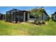 Home exterior with a screened lanai and well-manicured landscaping adding charm and privacy to the backyard at 13731 Vadini St, Venice, FL 34293