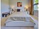 Well-lit bedroom showcasing a comfy bed, stylish bedside lamps, and neutral decor with a comfortable feel at 13731 Vadini St, Venice, FL 34293