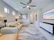 Comfortable living room featuring neutral walls, tile flooring, and modern artwork at 13731 Vadini St, Venice, FL 34293