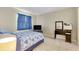 Simple bedroom with tiled floor, a bed with a patterned quilt, and a TV on a stand at 144 Rotonda Cir, Rotonda West, FL 33947