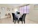 This dining area showcases a stylish table setting and decor under soft, natural light at 144 Rotonda Cir, Rotonda West, FL 33947