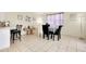 Dining area with tile floors, table and decorative items that create a comfortable and welcoming space at 144 Rotonda Cir, Rotonda West, FL 33947