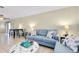 Inviting living area with ample seating, a decorative ottoman, and a view into the dining space at 144 Rotonda Cir, Rotonda West, FL 33947