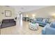 Open living space with tile floors, stylish furnishings, and a dining area, perfect for entertaining at 144 Rotonda Cir, Rotonda West, FL 33947