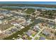 Stunning aerial view of waterfront homes with docks along winding canals, near lush mangroves and the open ocean at 15448 Avery Rd, Port Charlotte, FL 33981