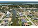 Aerial view showcasing a waterfront community, the home's location, and canal access to the open water at 15448 Avery Rd, Port Charlotte, FL 33981