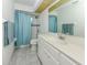Cozy bathroom with a shower/tub combo, vanity with sink and overhead lighting at 15448 Avery Rd, Port Charlotte, FL 33981
