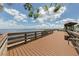 Scenic boardwalk with wooden rails and a covered gazebo overlooking the tranquil waters at 15448 Avery Rd, Port Charlotte, FL 33981