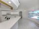 Bright, airy kitchen with modern appliances, breakfast bar, and view of the pool and waterfront at 15448 Avery Rd, Port Charlotte, FL 33981