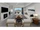 Bright and airy living room featuring a fireplace, modern furnishings, and sliding glass doors to the pool area at 15448 Avery Rd, Port Charlotte, FL 33981