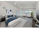 Beautifully staged main bedroom with waterfront views, seating area, and access to the outdoors at 15448 Avery Rd, Port Charlotte, FL 33981