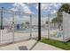 A refreshing community pool with a secure white fence, inviting lounge chairs, and swaying palm trees at 15448 Avery Rd, Port Charlotte, FL 33981