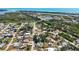 Desirable waterfront community aerial view shows mature trees, lush landscaping, and proximity to the river at 1568 Ringtail Rd, Venice, FL 34293