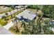 An elevated view showcases this beautiful single Gathering home, lush landscaping, and inviting curb appeal at 1568 Ringtail Rd, Venice, FL 34293