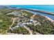 Beautiful aerial view of a community center, amenities, and beach access along the coast at 1568 Ringtail Rd, Venice, FL 34293