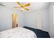Bedroom featuring a ceiling fan and closet space for ample storage at 1568 Ringtail Rd, Venice, FL 34293
