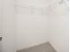Walk-in closet featuring carpet and shelf with supports at 1568 Ringtail Rd, Venice, FL 34293