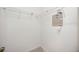 Walk-in closet featuring shelving and lighting for storage at 1568 Ringtail Rd, Venice, FL 34293