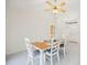 Bright dining area with tile floors, white furniture, and an airy atmosphere at 1568 Ringtail Rd, Venice, FL 34293