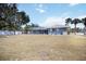 The exterior of the home includes a screened-in pool and a spacious backyard at 1568 Ringtail Rd, Venice, FL 34293