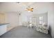 Inviting living room with bright light, comfortable seating, and ceiling fan at 1568 Ringtail Rd, Venice, FL 34293