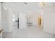 Open-concept living space featuring tile floors, vaulted ceilings, and seamless transitions to the dining and kitchen areas at 1568 Ringtail Rd, Venice, FL 34293