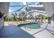 Enclosed in-ground pool area with covered seating offers a relaxing outdoor experience at 1568 Ringtail Rd, Venice, FL 34293