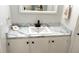 Stylish bathroom with updated vanity, marble countertop, and ample storage at 177 Palm Harbor Dr, North Port, FL 34287