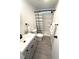 Renovated bathroom featuring a modern vanity, toilet, and walk-in shower at 177 Palm Harbor Dr, North Port, FL 34287
