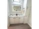 Clean bathroom with modern vanity, marble countertop, and ample storage at 177 Palm Harbor Dr, North Port, FL 34287