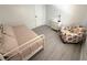 Guest bedroom featuring a daybed, dresser, and comfortable chair at 177 Palm Harbor Dr, North Port, FL 34287